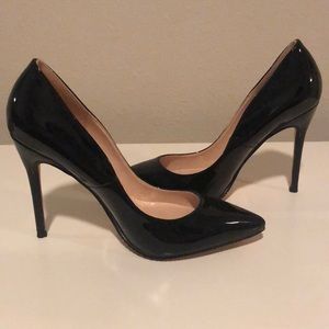Black pointed toe patent leather heels